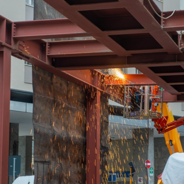 Demolition iron structure with blowtorch